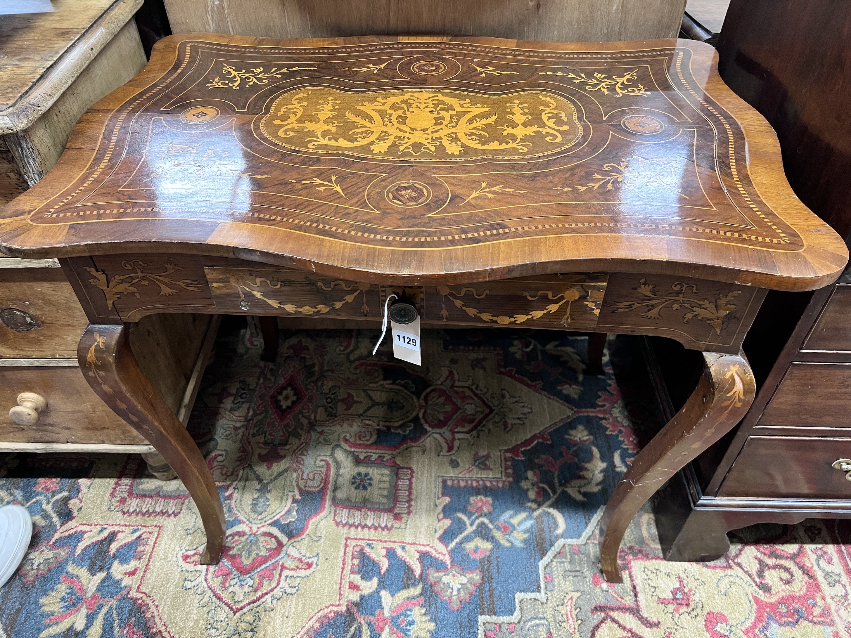 A 19th century Continental marquetry inlaid walnut occasional table, width 89cm